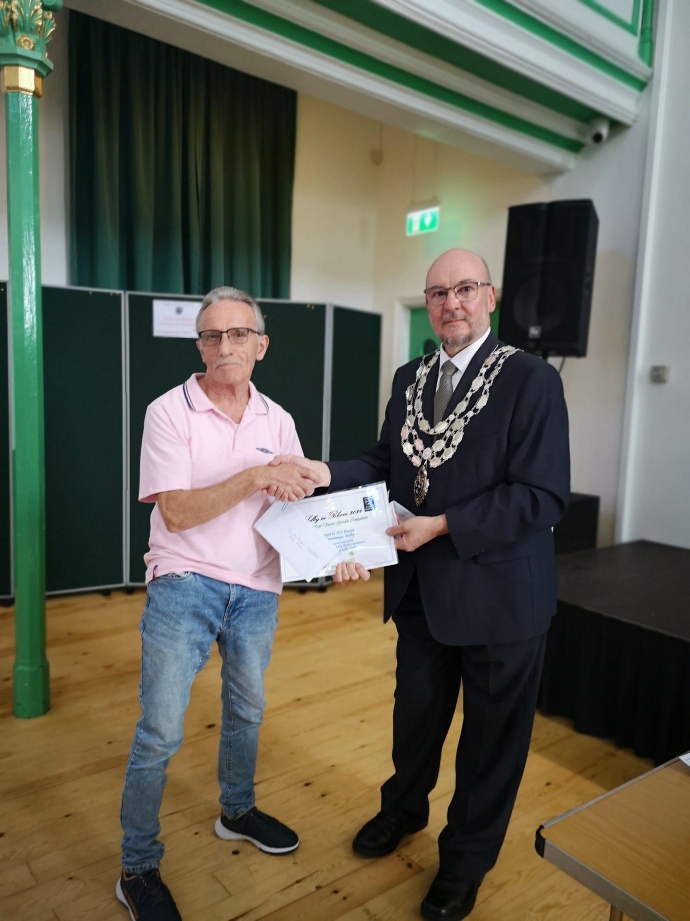 The mayor presenting a certificate to one of the winners of the Selby in Bloom allotment competition 2