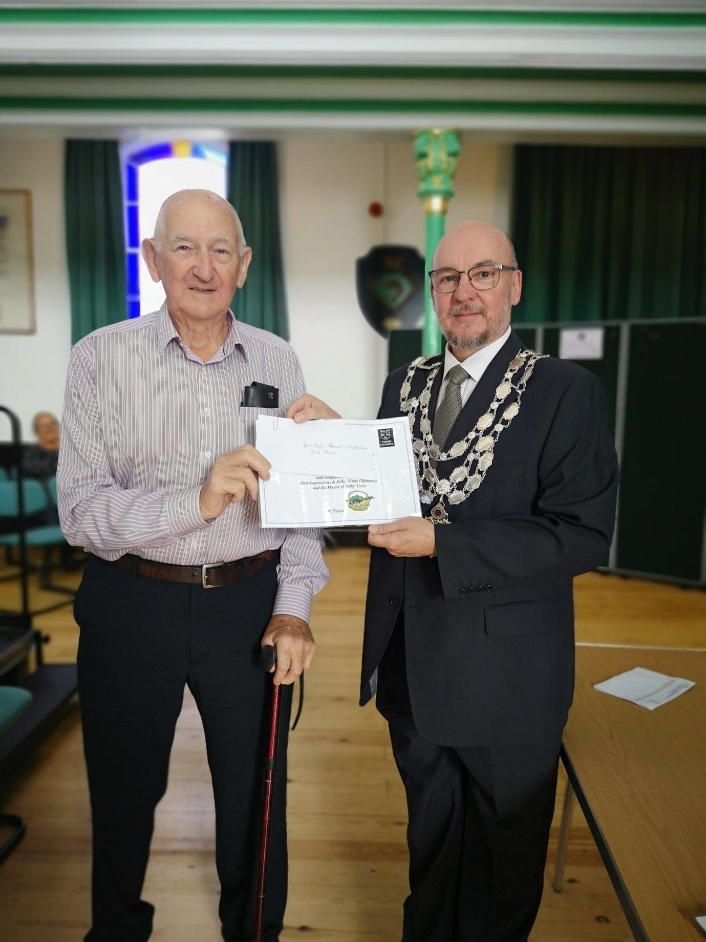 The mayor presenting a certificate to one of the winners of the Selby in Bloom allotment competition 1