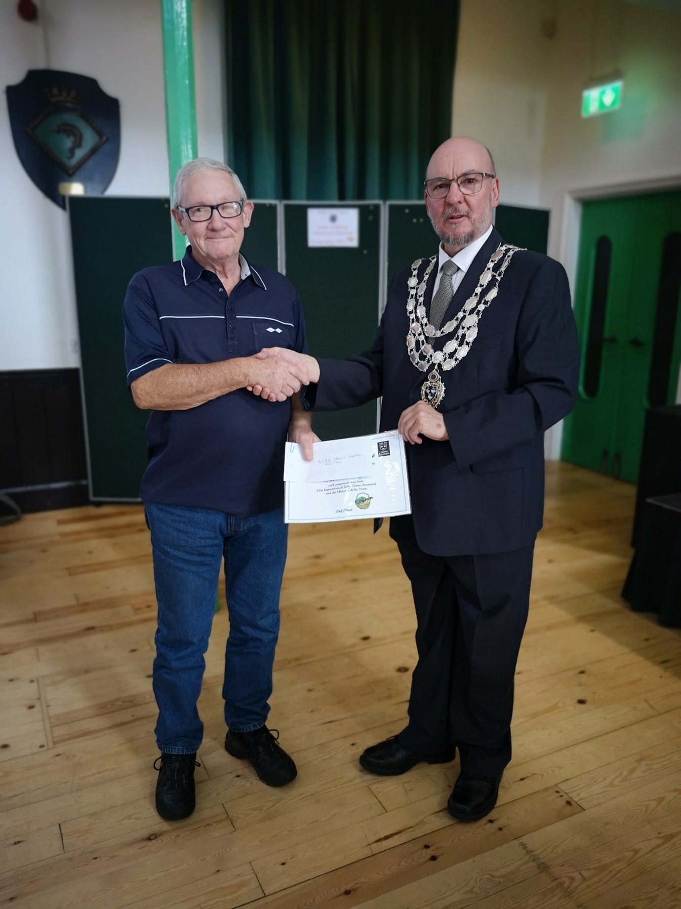 This photo shows the Mayor congratulating one of the winners of Selby in Bloom 1
