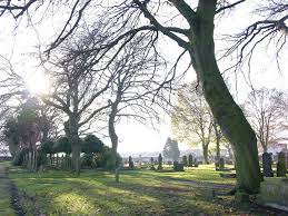 The picture shows a view across the cemetery