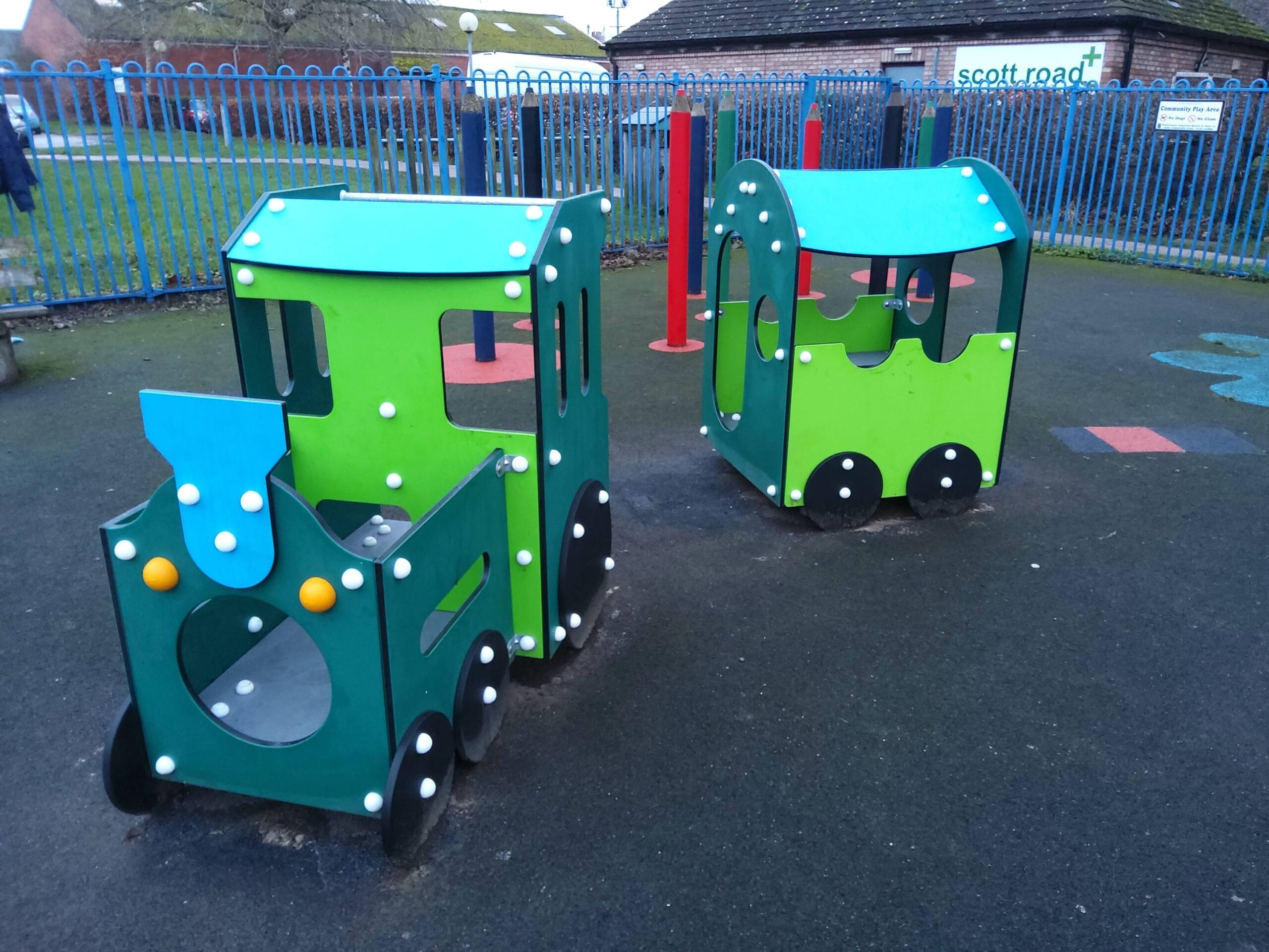 This is a photo of the new toddler train in the play area. It is various shades of green