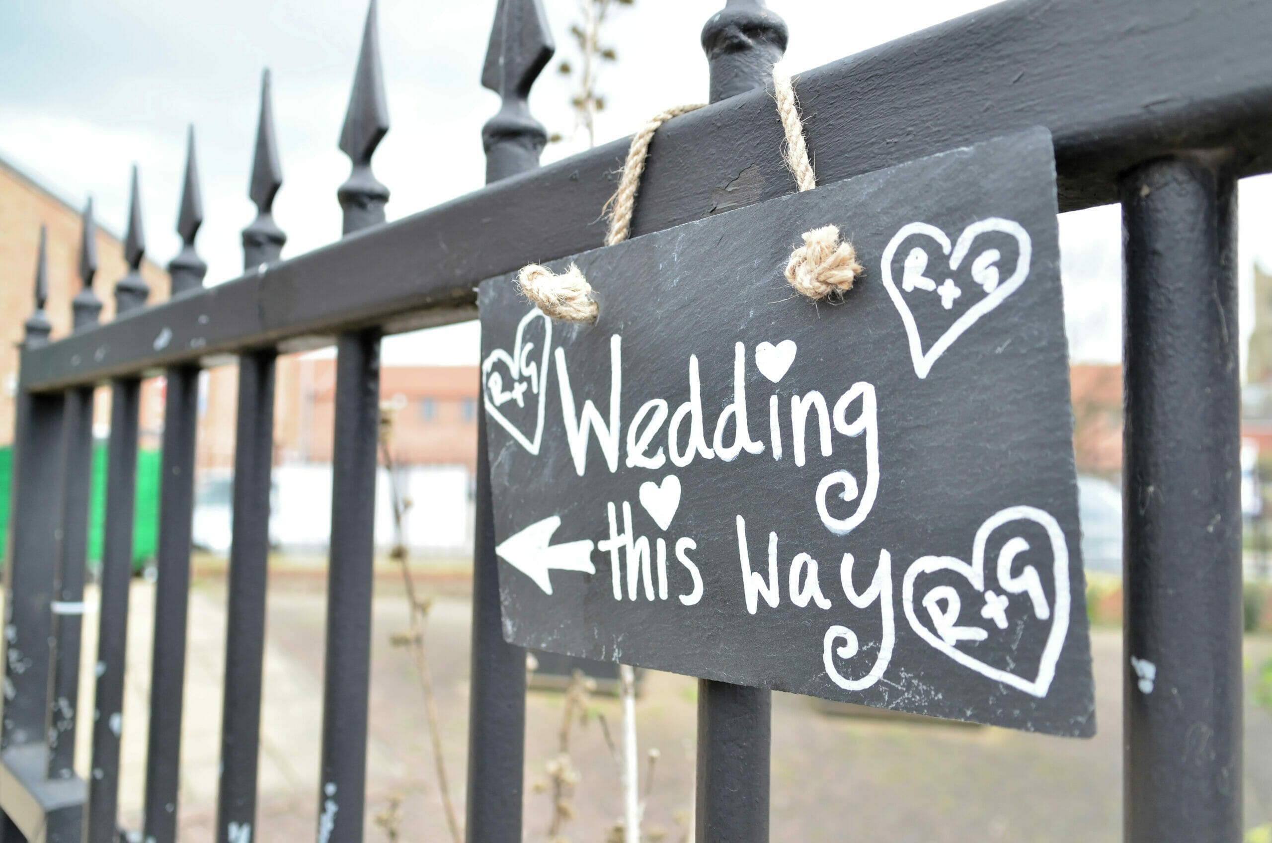 Photo shows a sign signing wedding this way