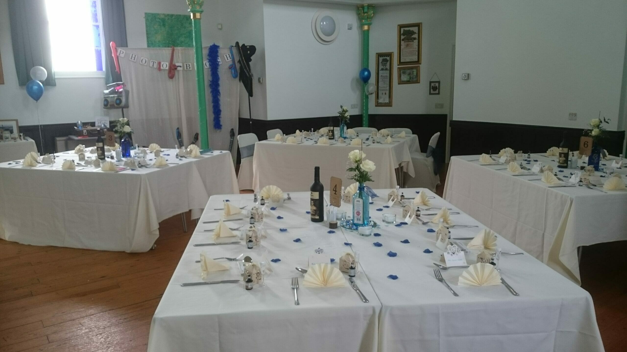 Photo shows a room layout with square tables