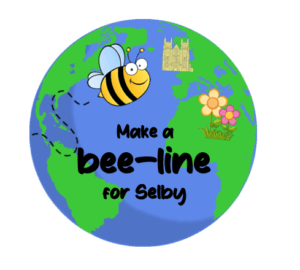 This is a picture of the Bee Stickers that are awarded to residents who are making nature a priority in their gardens. The sticker is a globe with a bee flying to Selby, which is marked on the globe with a picture of Selby Abbey. The tag line written on the sticker says Make a Bee Line for Selby.
