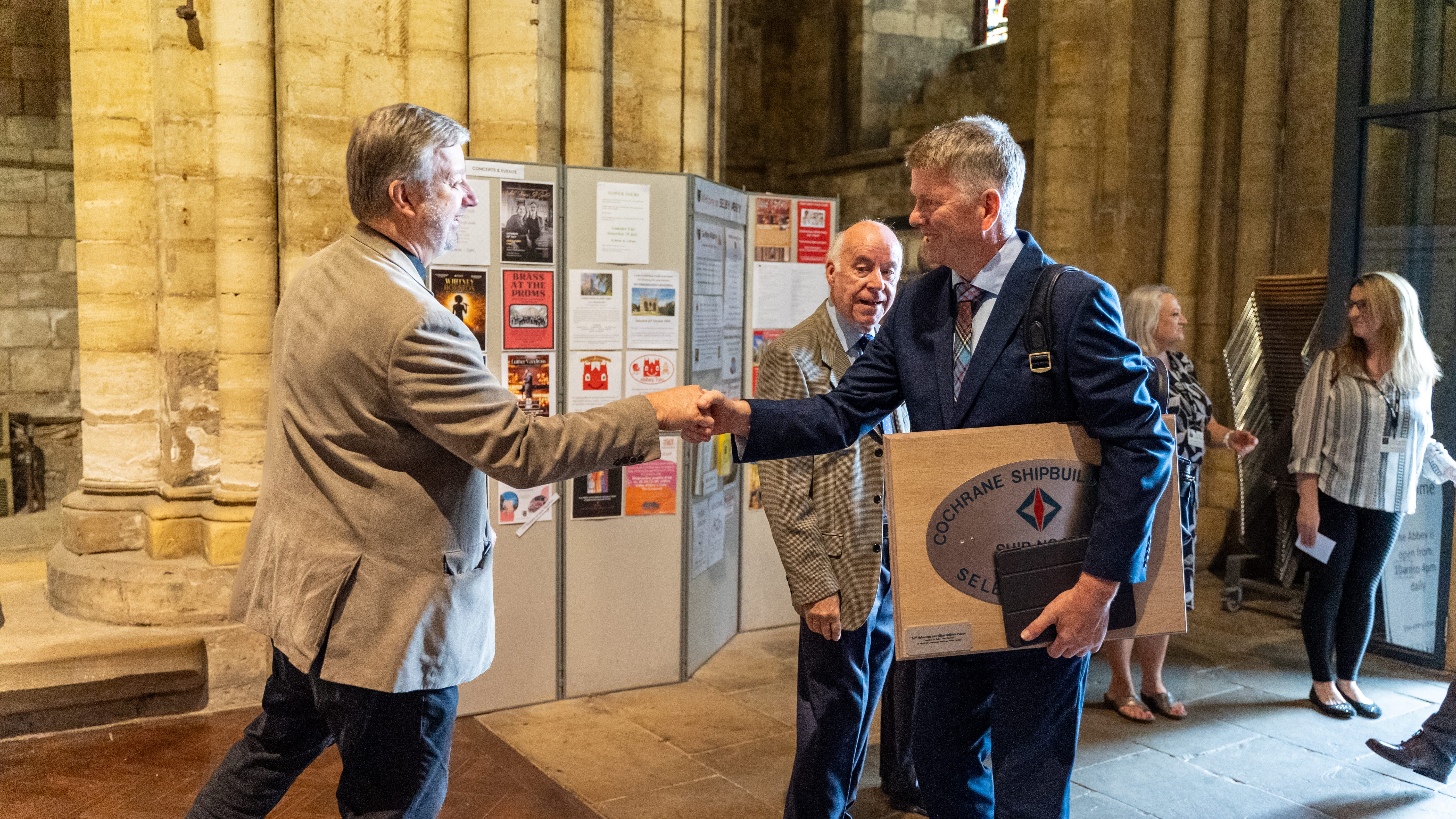 Photo of two people shaking hands