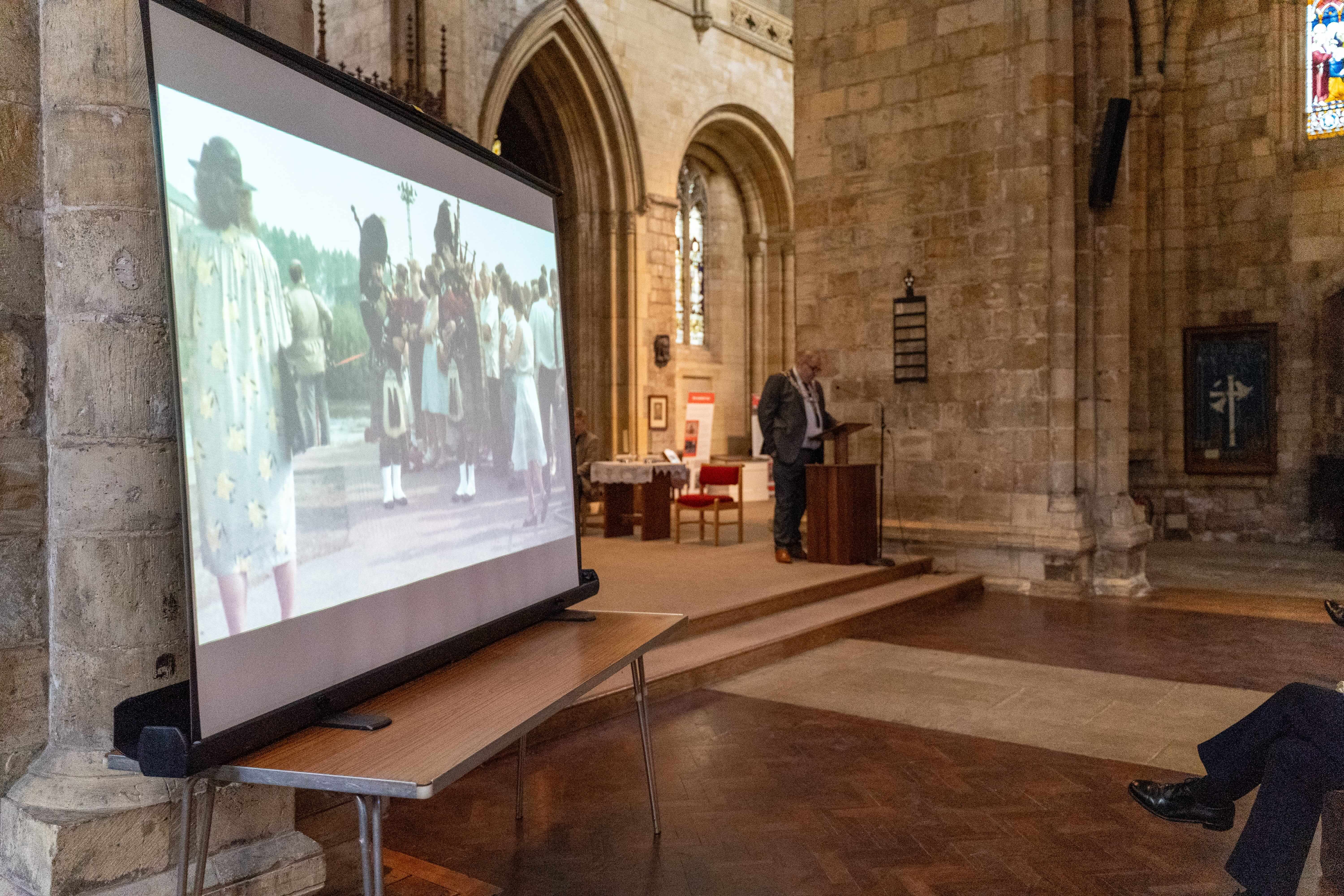 A photo of the mayor of Selby giving a speech in Selby Abbey