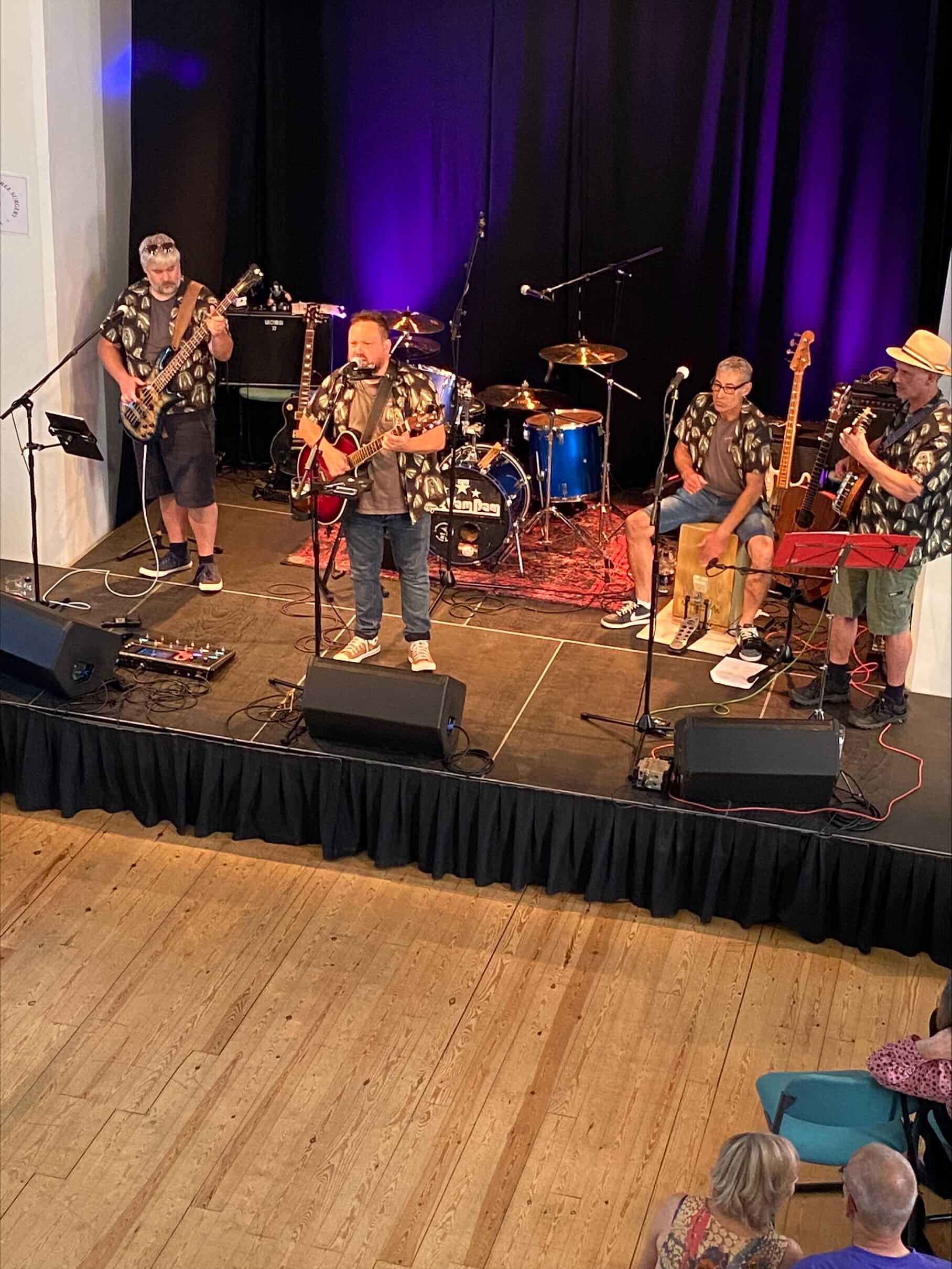 Photograph of a band on stage